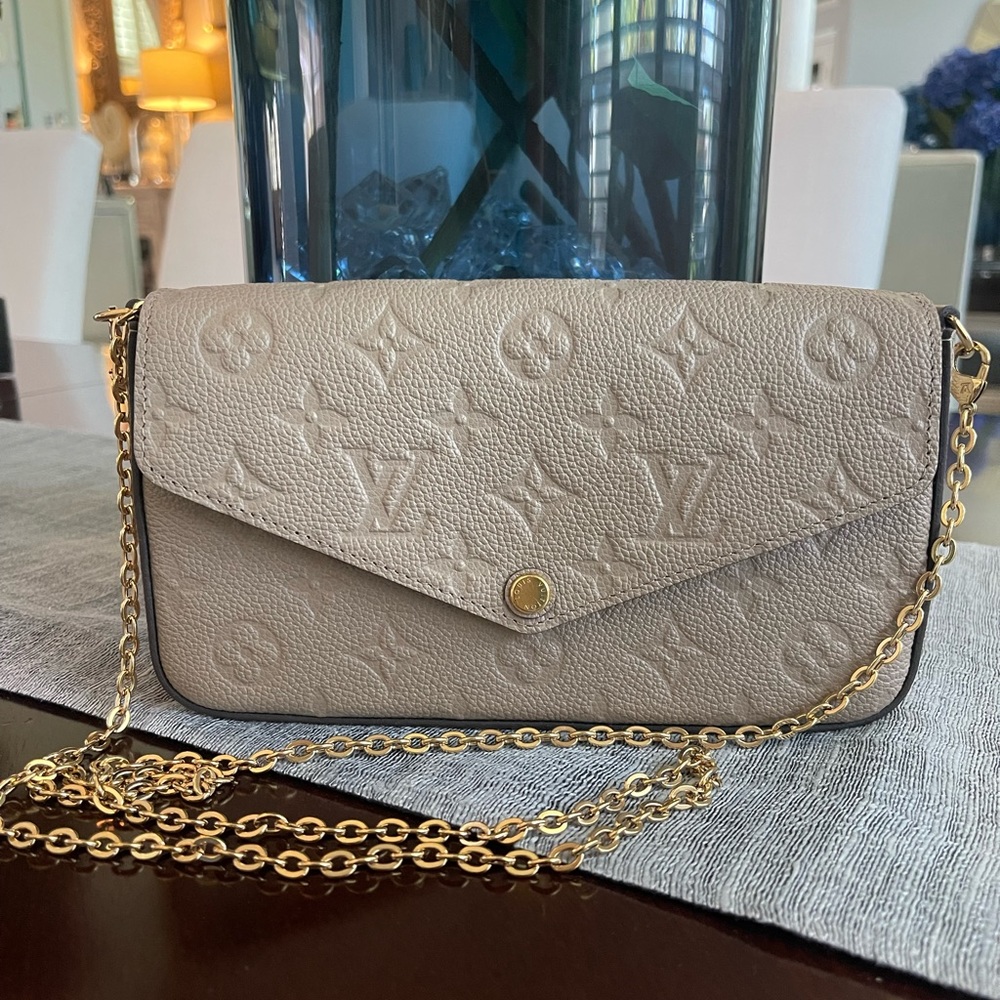 SOLD! LV clutch almost new.. 100% authentic.  Original receipt included.